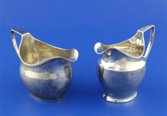 Two George III silver helmet shaped cream jugs, 6 oz.